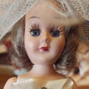 Vintage Sleepy Eyed Doll In Ivory Dress